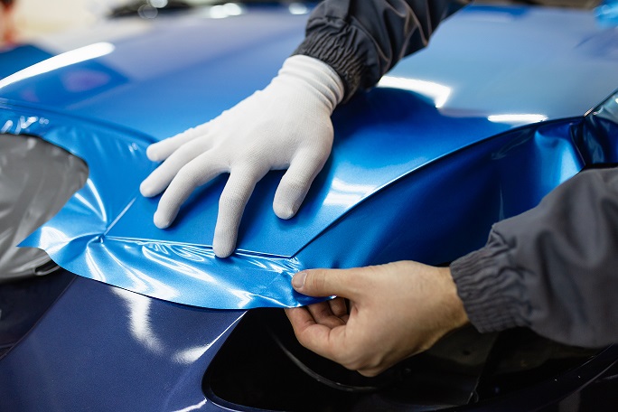 Why are companies using vehicle vinyl wrap to promote their business?
